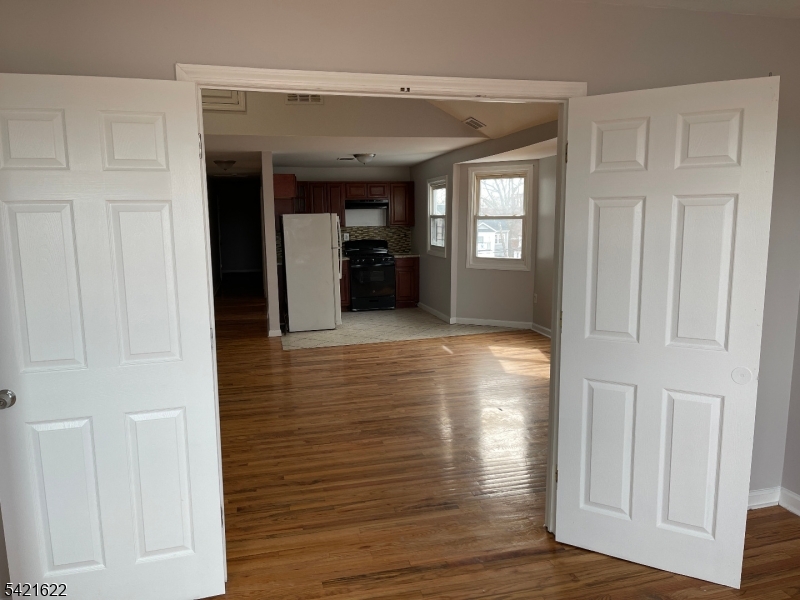 784 South 19th Street, Unit 2 Newark, NJ 07103 - Photo 6 of 11 a view of a hallway view with wooden floor and staircase