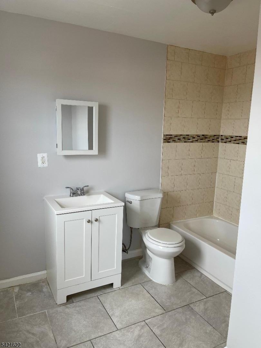 784 South 19th Street, Unit 2 Newark, NJ 07103 - Photo 7 of 11 a bathroom with a sink toilet and shower