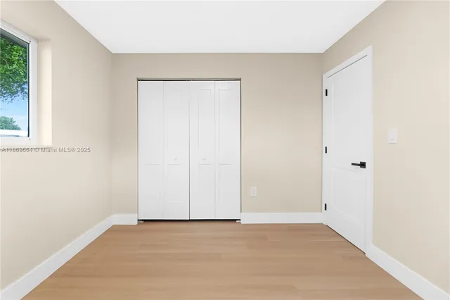 a bathroom with a toilet sink and shower