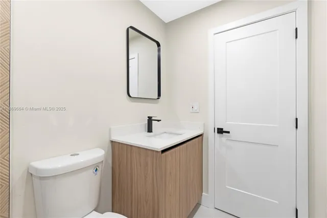 a bathroom with a shower toilet and sink