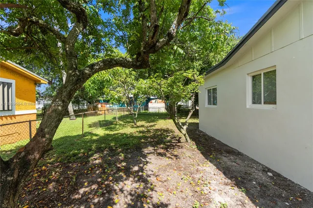 a house view with a garden space