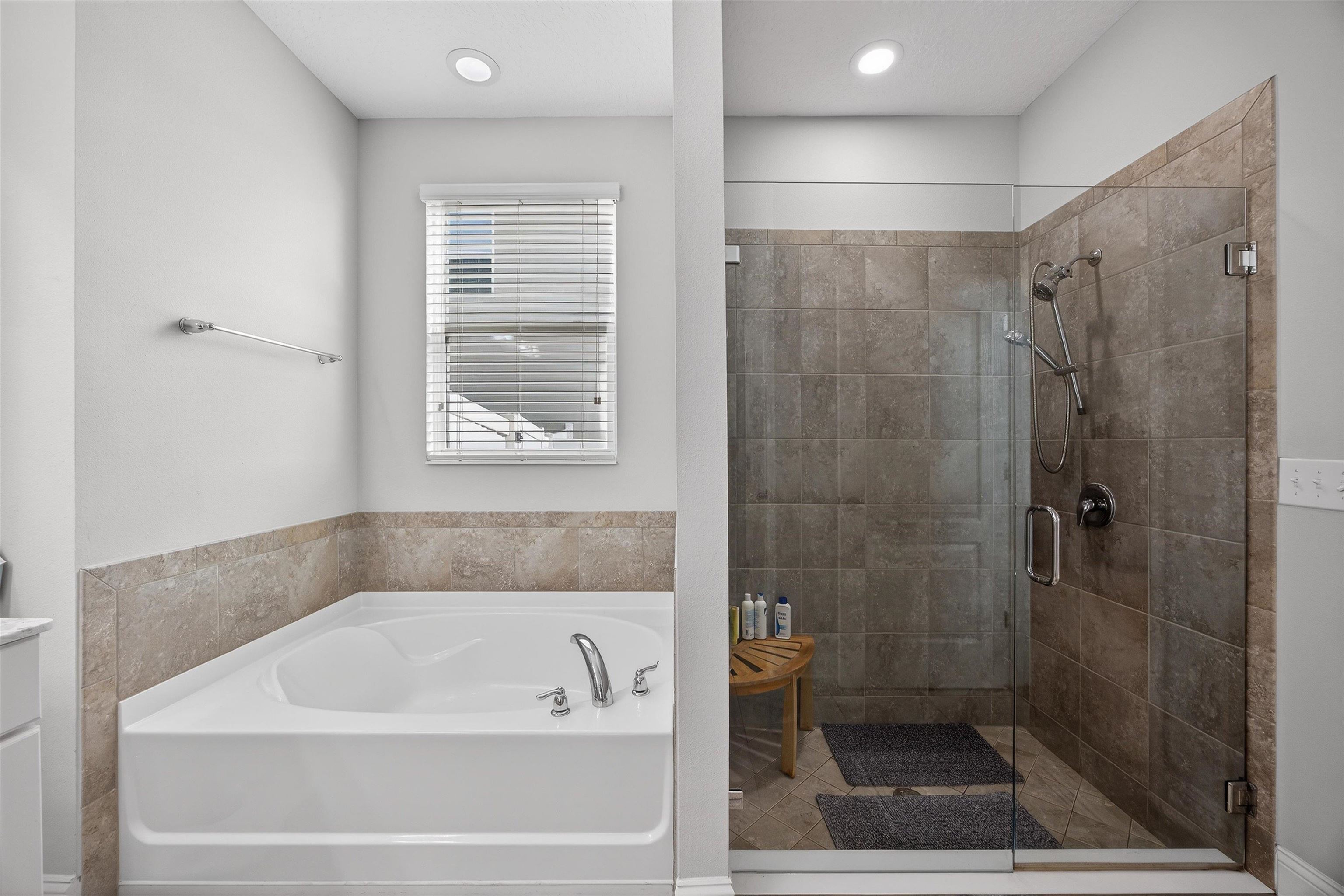 50 Sierras Loop St. Augustine, FL 32086 - Photo 13 of 37 a bathroom with a bathtub and a shower