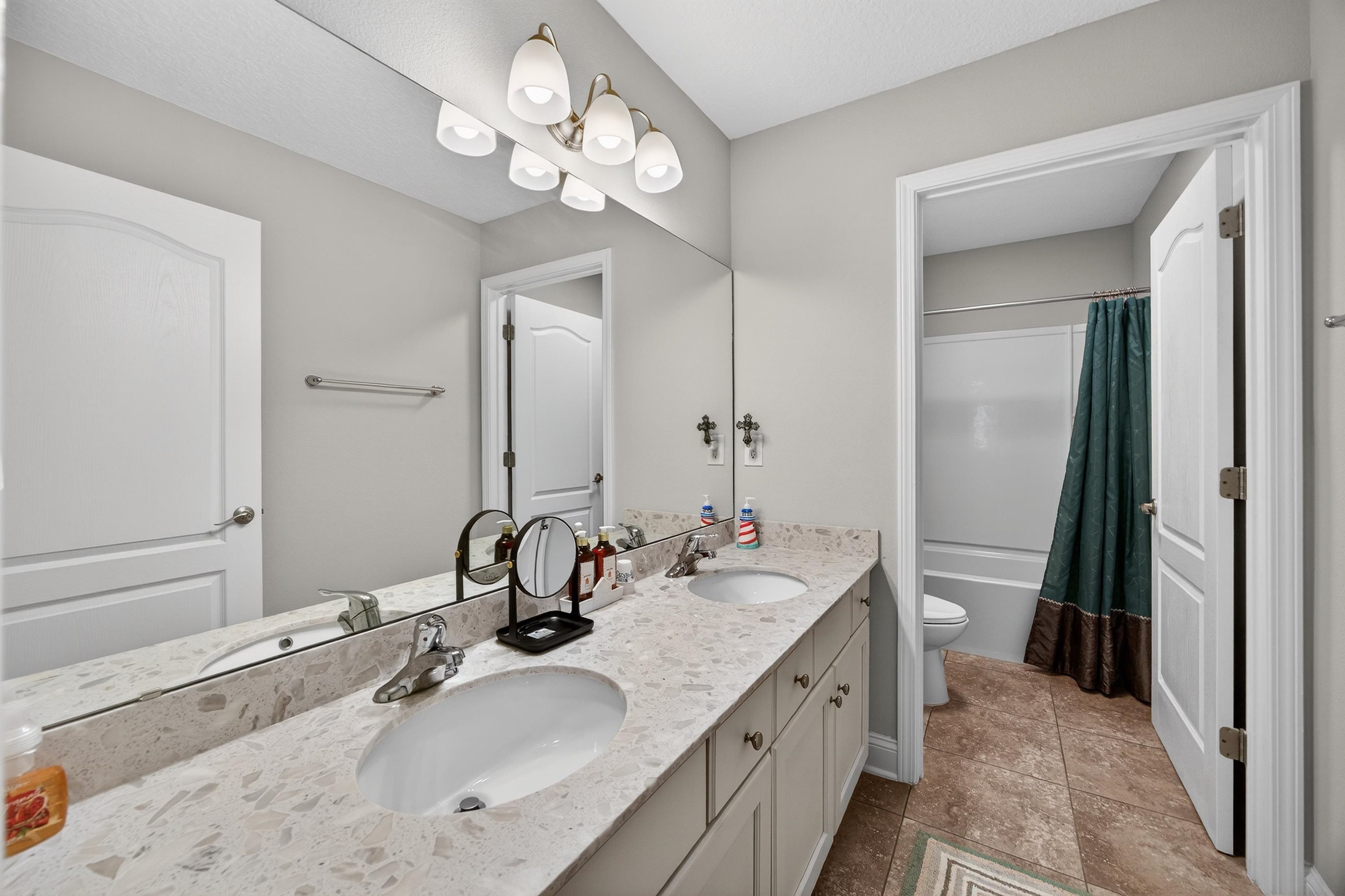50 Sierras Loop St. Augustine, FL 32086 - Photo 17 of 37 a bathroom with a double vanity sink and a mirror