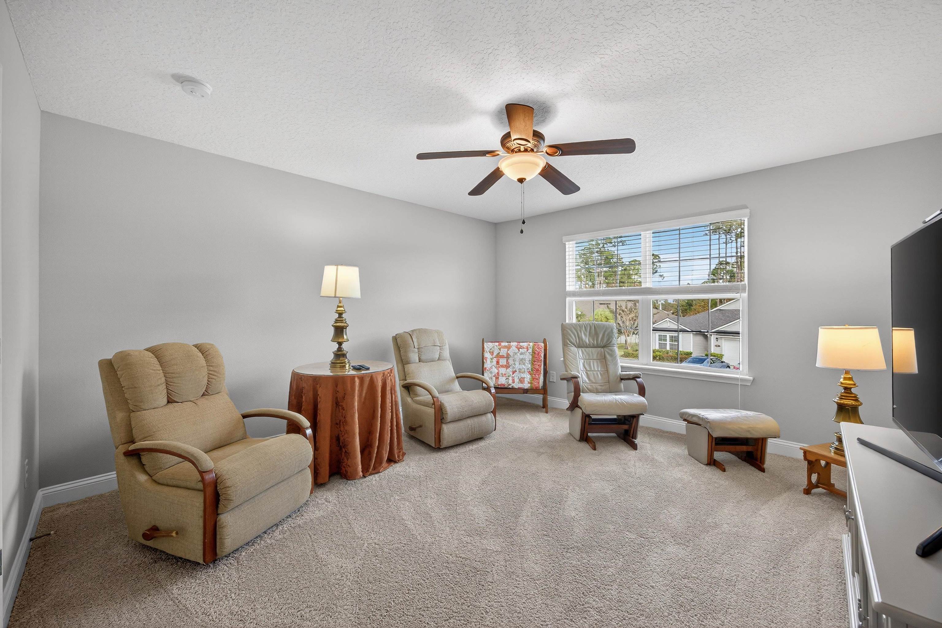 50 Sierras Loop St. Augustine, FL 32086 - Photo 18 of 37 a living room with furniture ceiling fan and a window