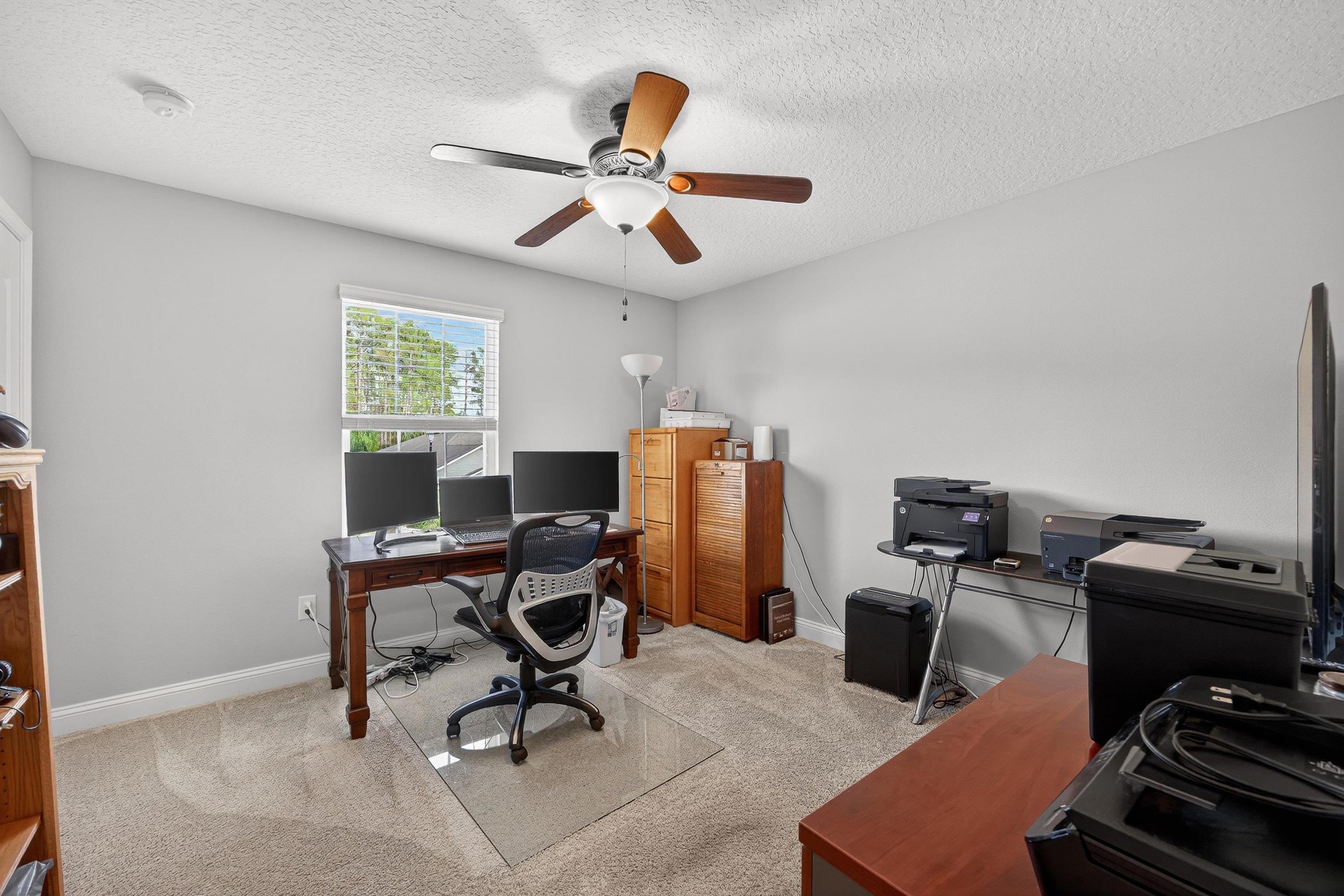 50 Sierras Loop St. Augustine, FL 32086 - Photo 19 of 37 a view of a workspace with furniture and a window