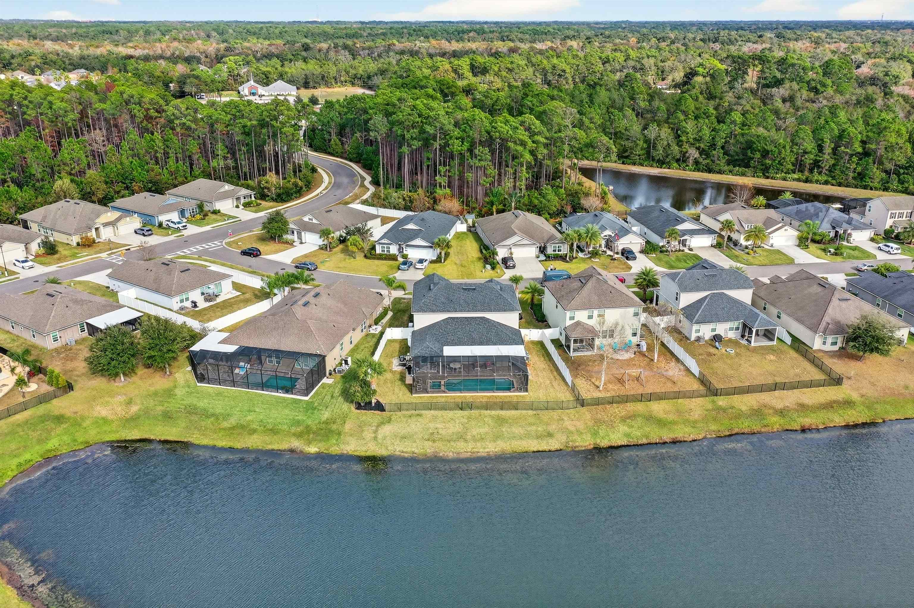 50 Sierras Loop St. Augustine, FL 32086 - Photo 27 of 37 a view of a swimming pool with a garden