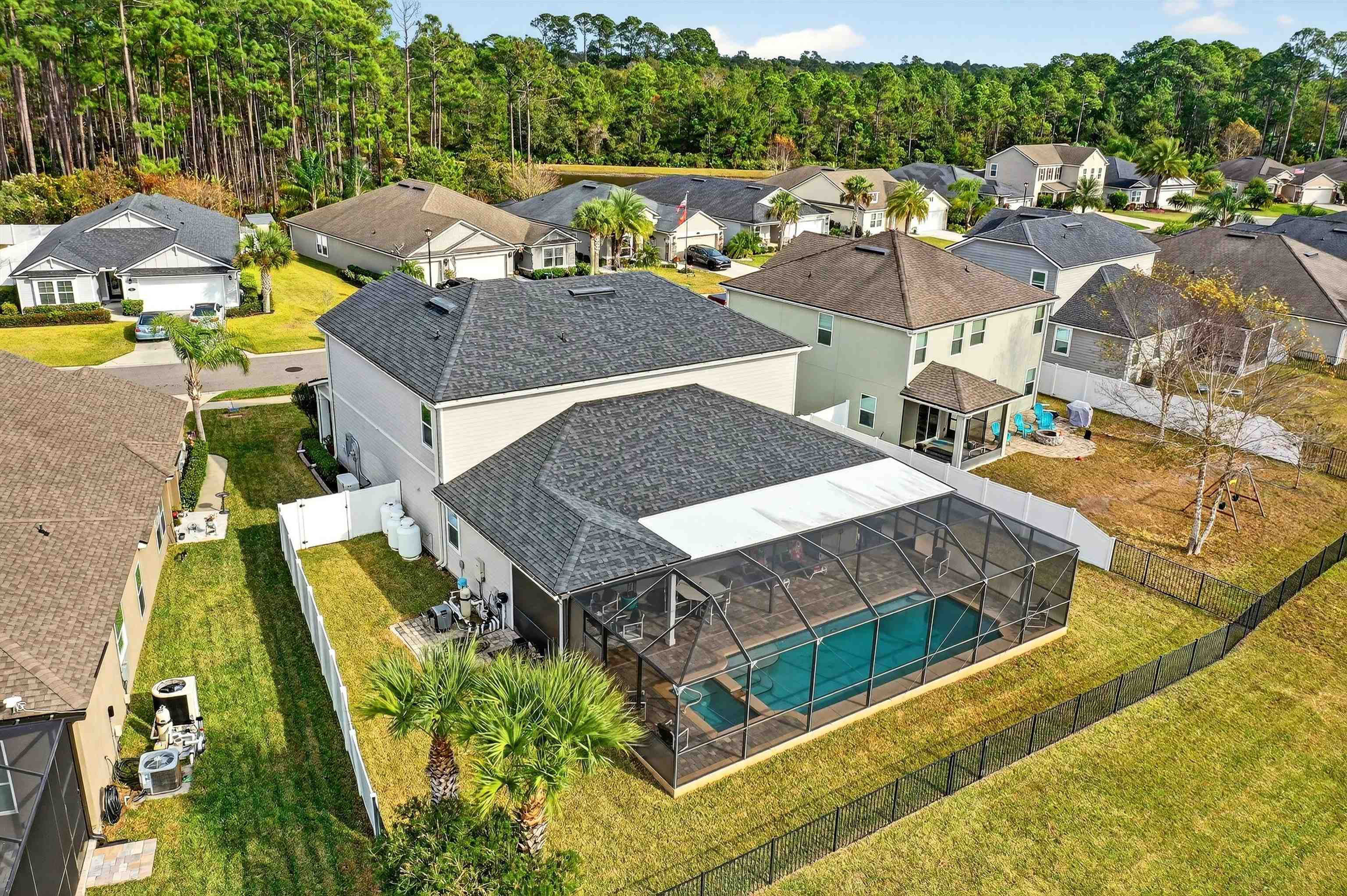 50 Sierras Loop St. Augustine, FL 32086 - Photo 28 of 37 an aerial view of a house with swimming pool and outdoor seating