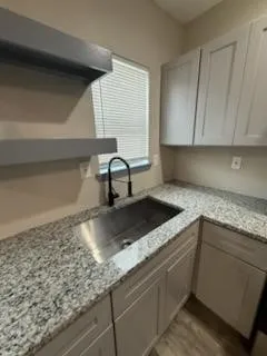 a view of a kitchen with sink and dishwasher