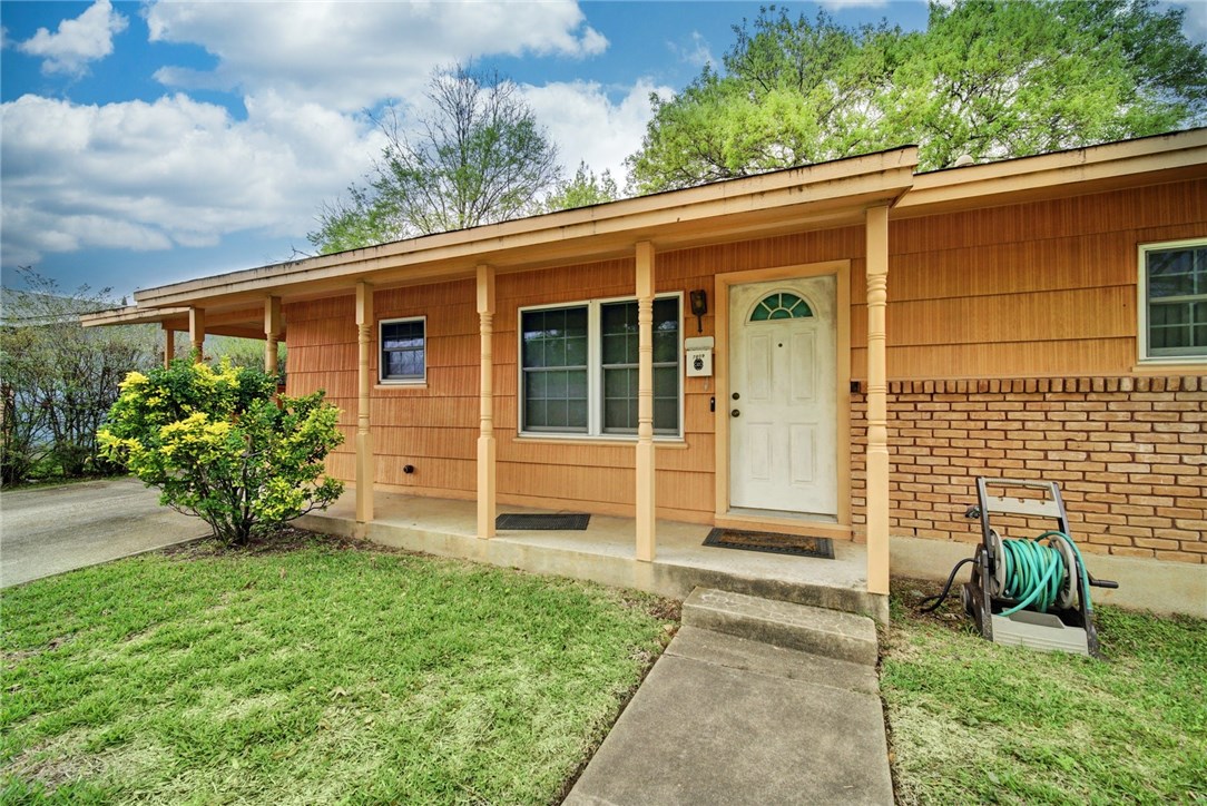 7809 Mullen Drive Austin, TX 78757 - Photo 1 of 1 front view of a house with a yard