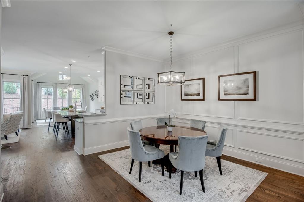 3450 Commander Cove Suwanee, GA 30024 - Photo 13 of 51 a view of a dining room with furniture and wooden floor