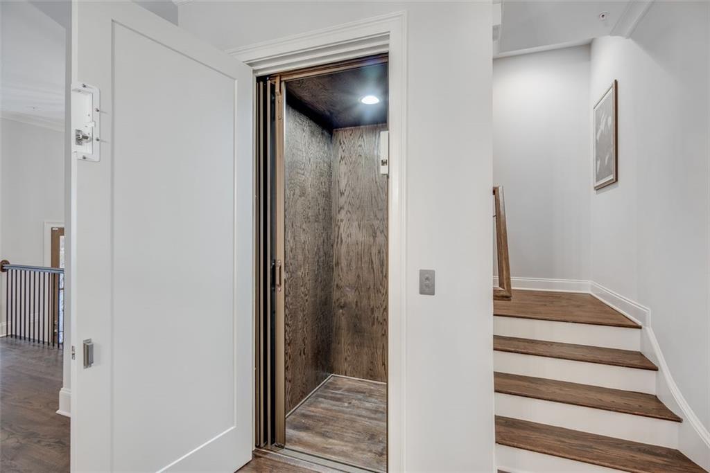 3450 Commander Cove Suwanee, GA 30024 - Photo 23 of 51 a view of a hallway with wooden floor and entryway