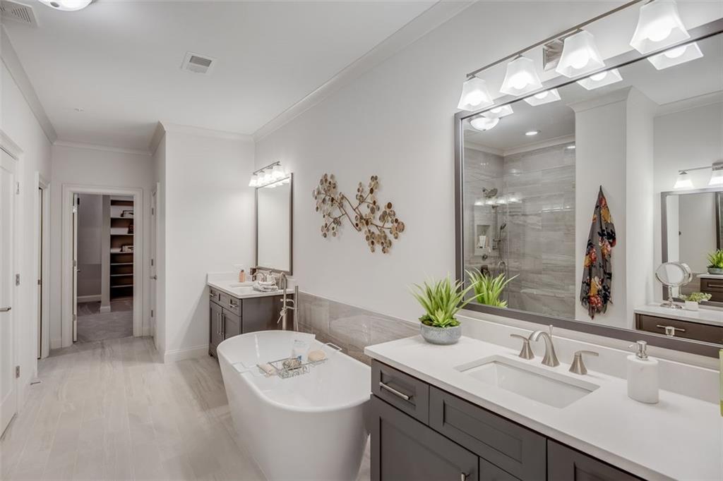 3450 Commander Cove Suwanee, GA 30024 - Photo 27 of 53 a bathroom with a sink double vanity and a mirror