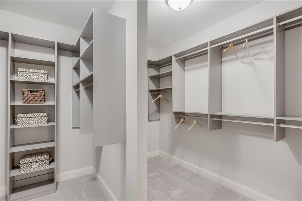 3450 Commander Cove Suwanee, GA 30024 - Photo 28 of 51 a view of walk in closet with empty racks