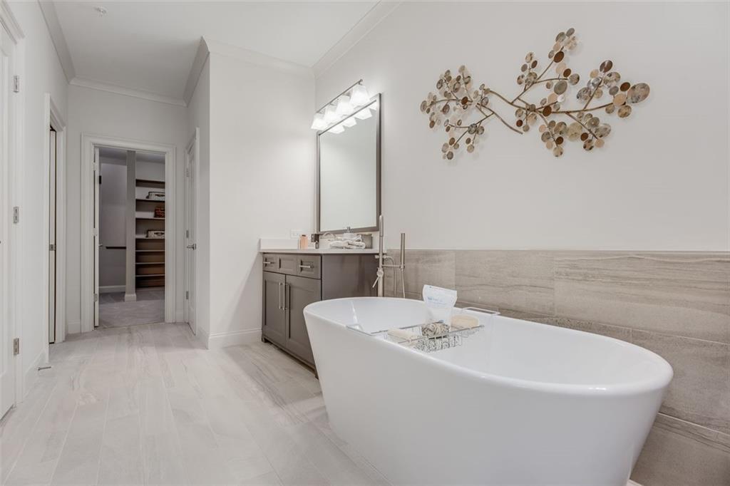 3450 Commander Cove Suwanee, GA 30024 - Photo 29 of 53 a white bath tub sitting next to a white sink