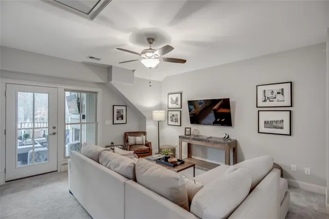 a kitchen with a sink cabinets and wooden floor