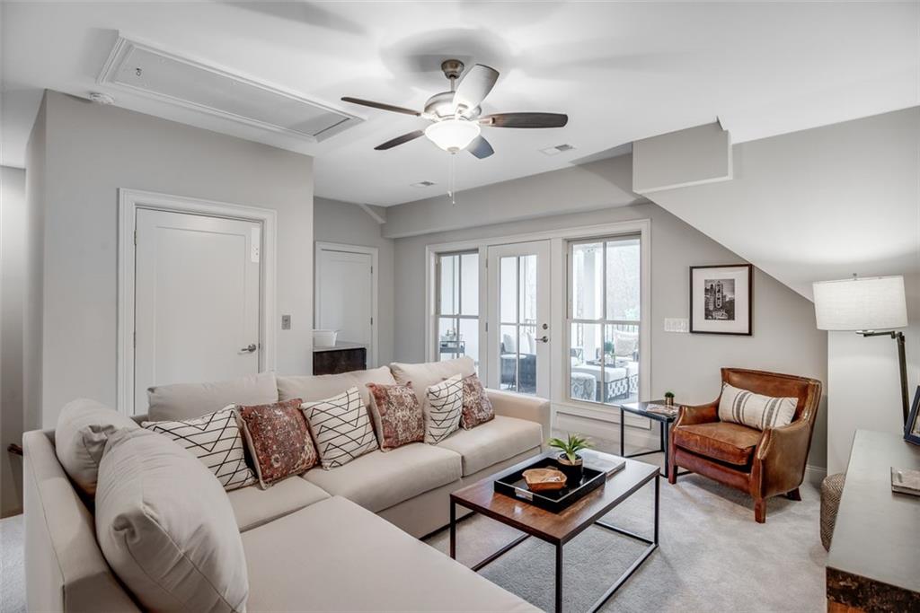 3450 Commander Cove Suwanee, GA 30024 - Photo 33 of 51 a living room with furniture and a large window