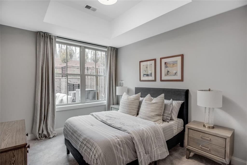 3450 Commander Cove Suwanee, GA 30024 - Photo 39 of 51 a bedroom with a bed and a window