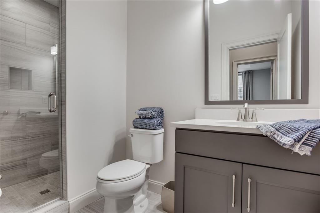 3450 Commander Cove Suwanee, GA 30024 - Photo 40 of 51 a bathroom with a sink toilet and shower
