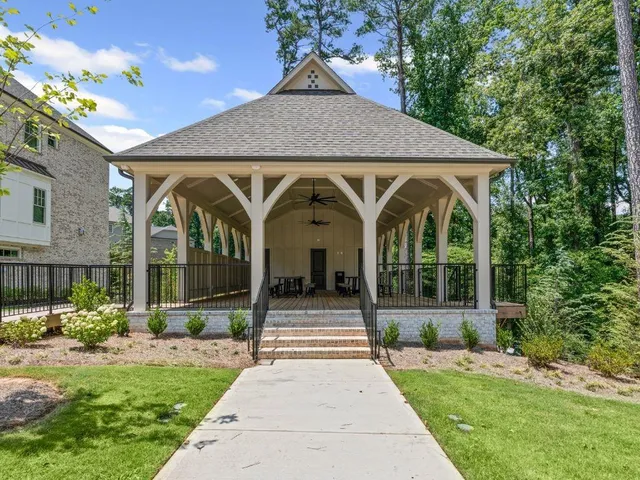 a view of a garden with lawn chairs