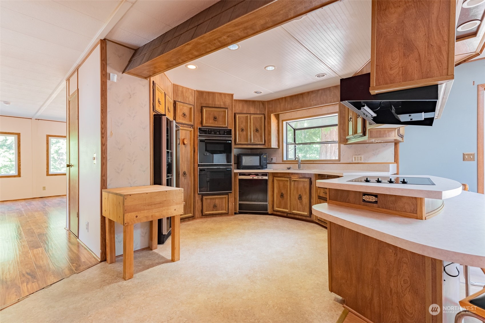 1069 East Axton Road Bellingham, WA 98226 - Photo 11 of 33 a kitchen with stainless steel appliances a stove and more cabinets