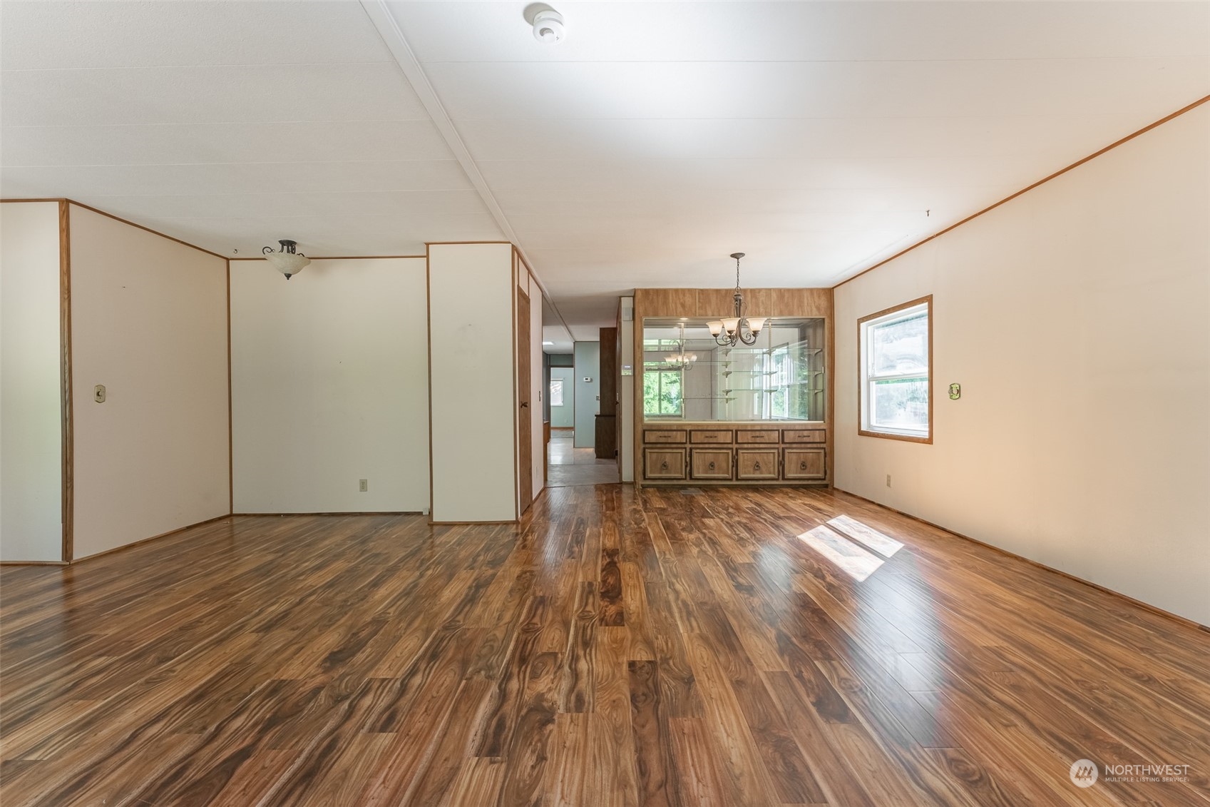 1069 East Axton Road Bellingham, WA 98226 - Photo 13 of 33 an empty room with wooden floor and windows