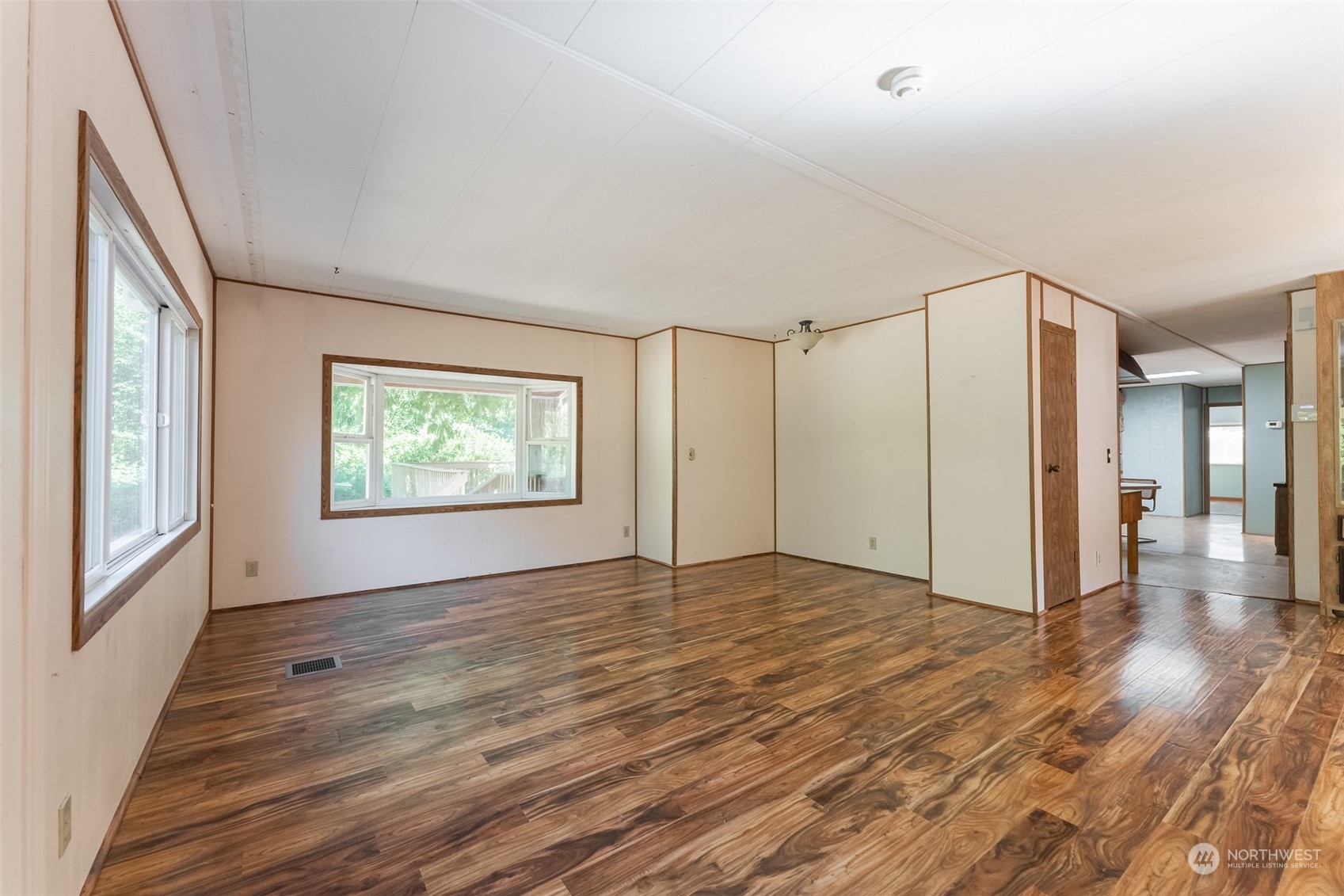 1069 East Axton Road Bellingham, WA 98226 - Photo 14 of 33 a view of an empty room with wooden floor and a window