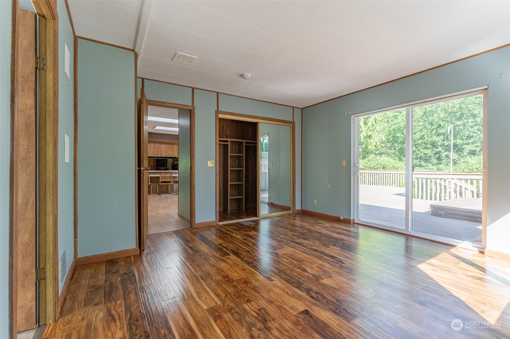 1069 East Axton Road Bellingham, WA 98226 - Photo 15 of 33 a view of an empty room with wooden floor and a window