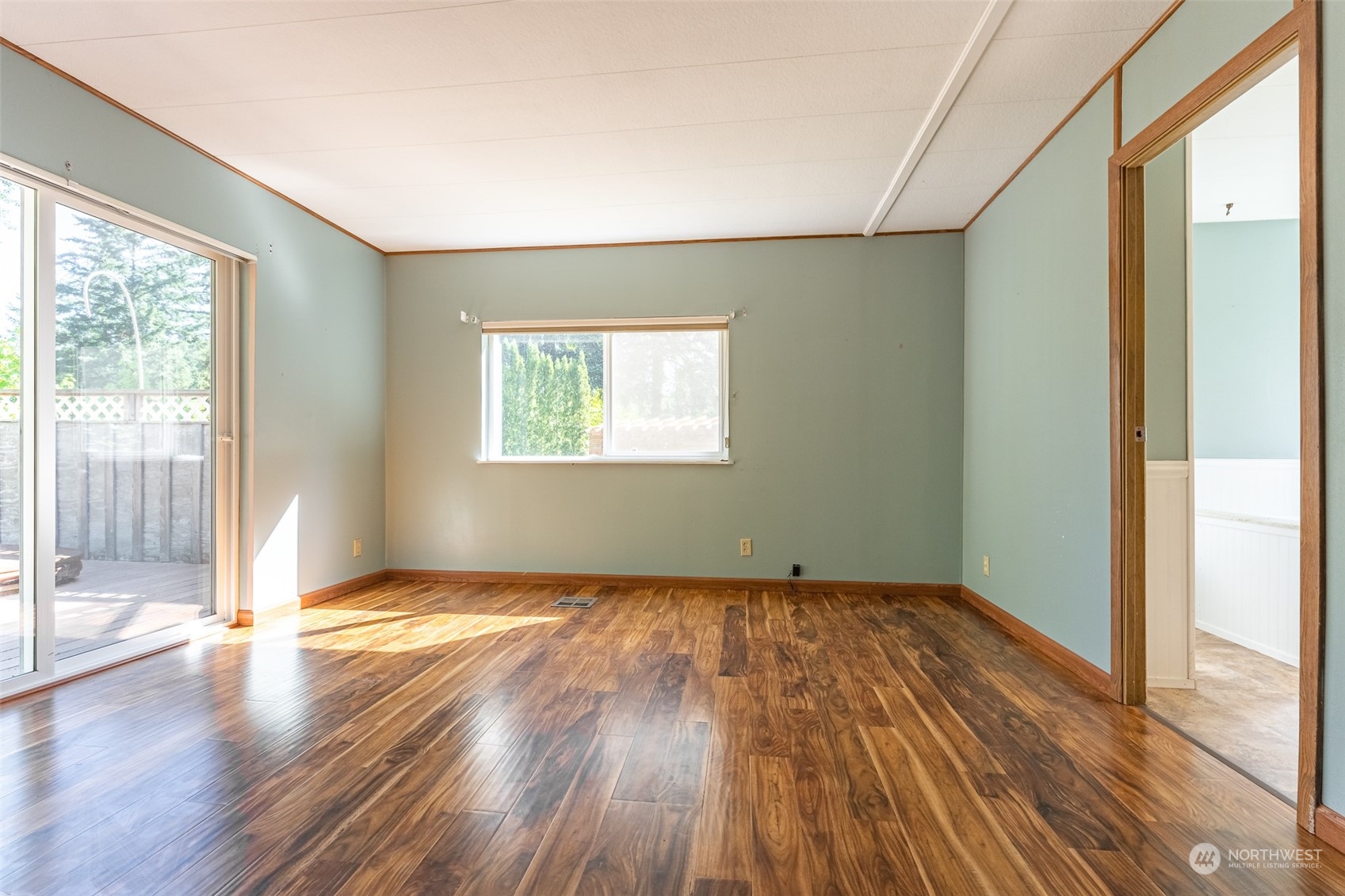 1069 East Axton Road Bellingham, WA 98226 - Photo 16 of 33 a view of an empty room with wooden floor and a window