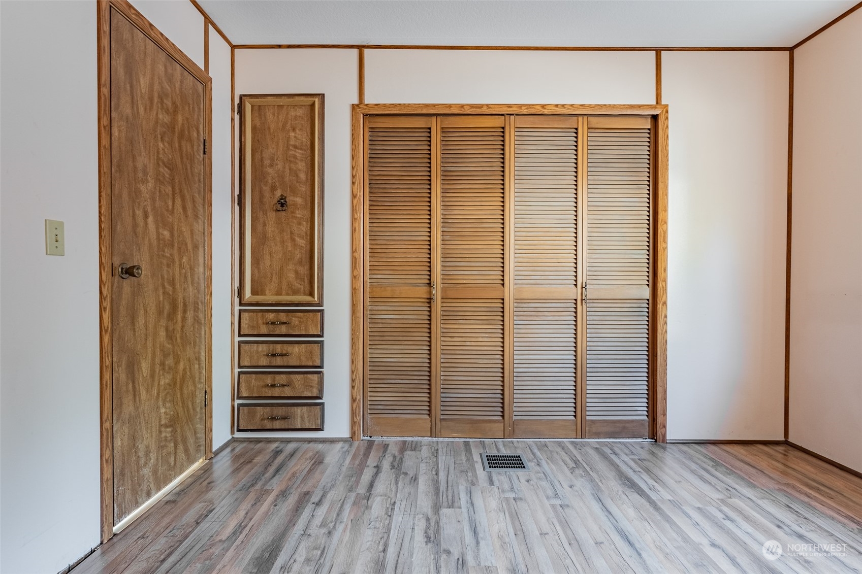 1069 East Axton Road Bellingham, WA 98226 - Photo 19 of 33 an empty room with wooden floor and windows
