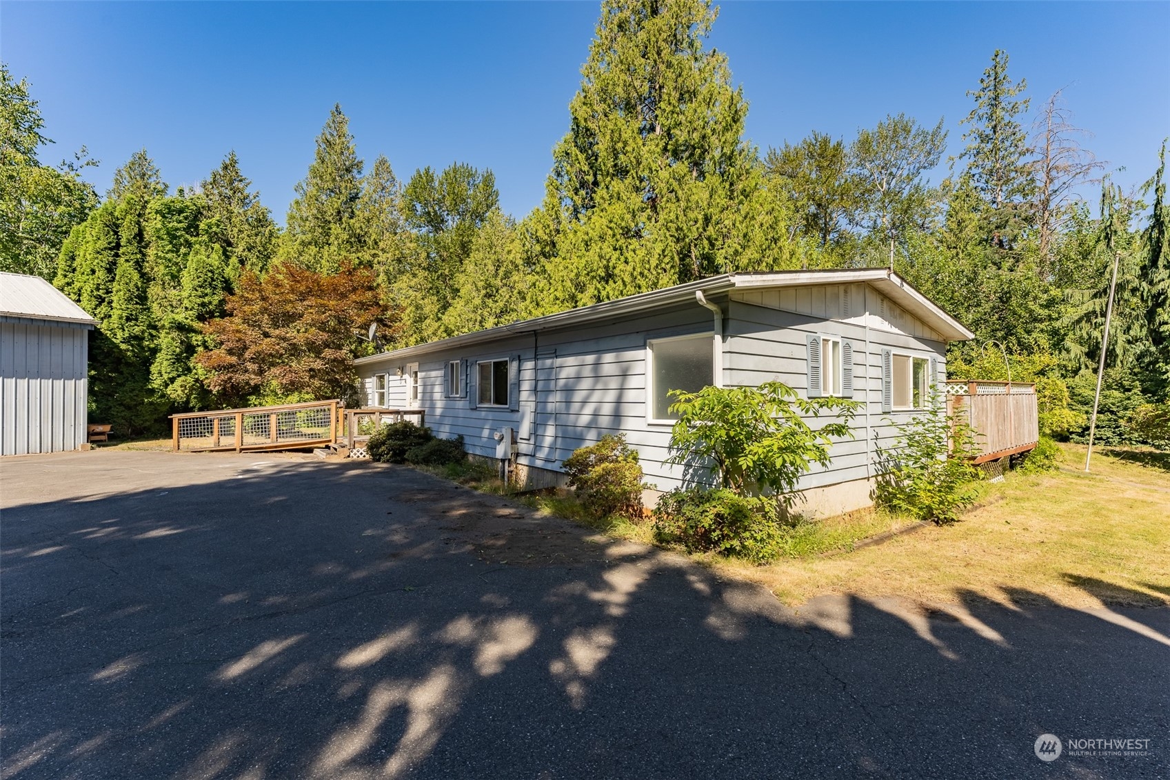 1069 East Axton Road Bellingham, WA 98226 - Photo 5 of 33 a view of a house with a tree in the background