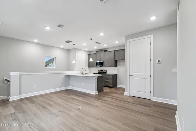a bathroom with a double vanity sink and mirror