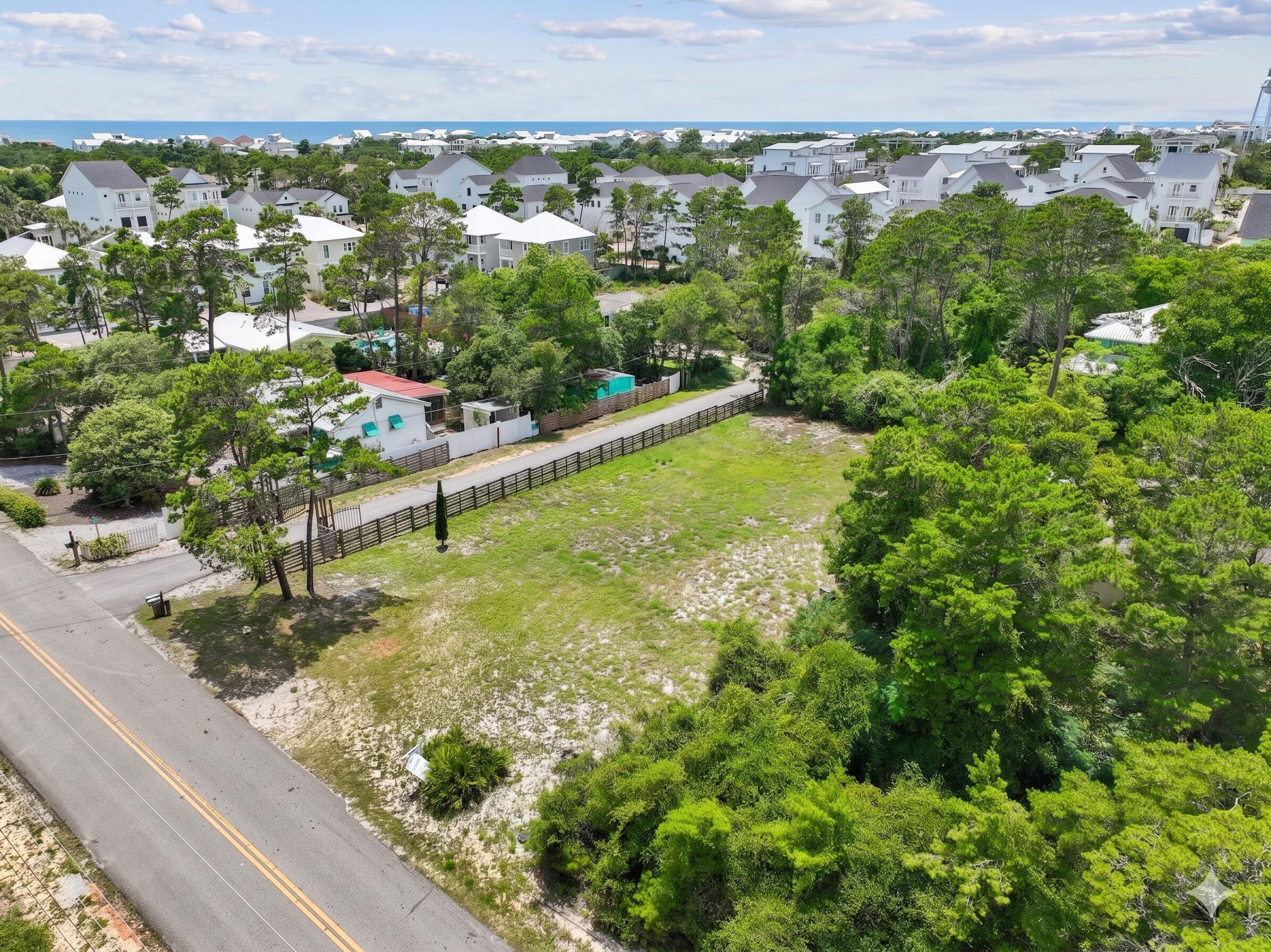 275 North Orange Street Inlet Beach, FL 32461 - Photo 3 of 5 a view of a lake with a city