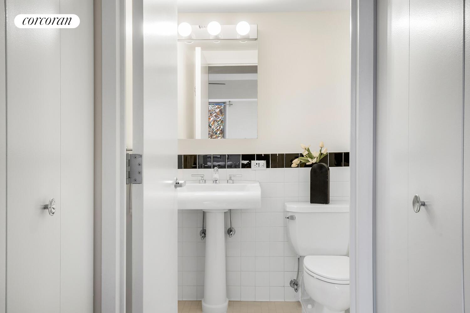 300 West 145th Street, Unit 1K Manhattan, NY 10039 - Photo 14 of 28 a bathroom with a sink a toilet and shower