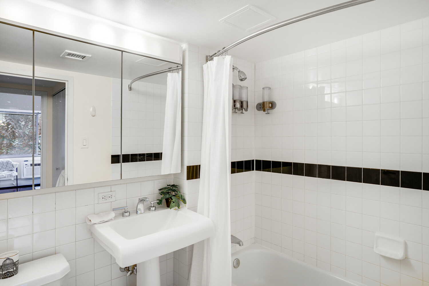 300 West 145th Street, Unit 1K Manhattan, NY 10039 - Photo 26 of 28 a bathroom with a sink and a mirror