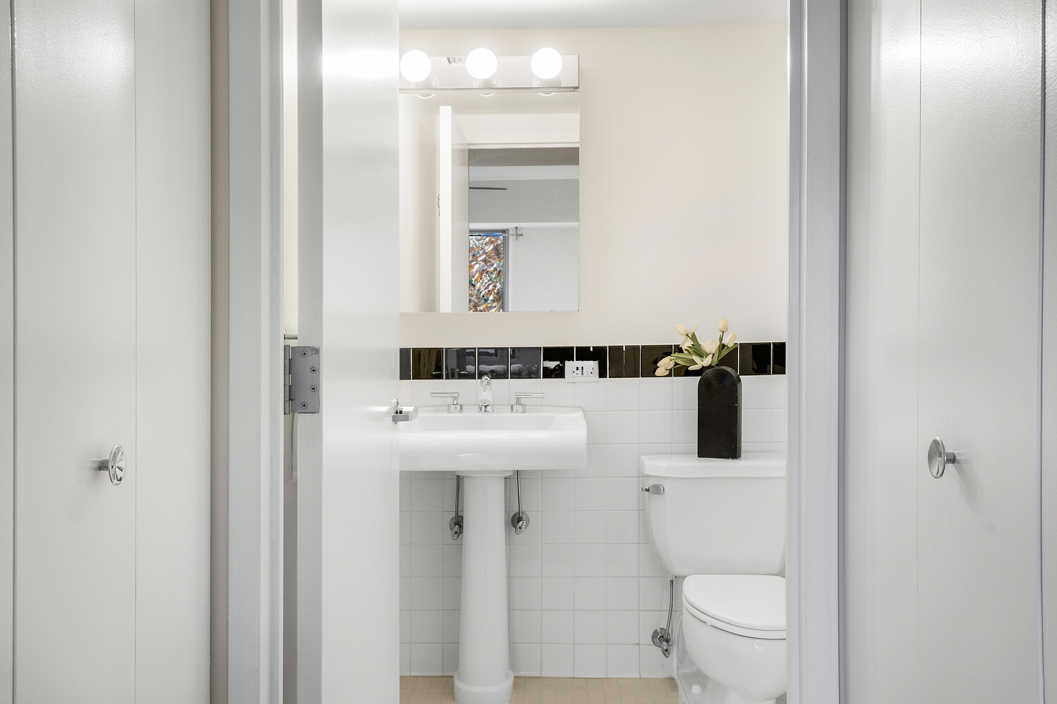 300 West 145th Street, Unit 1K Manhattan, NY 10039 - Photo 27 of 28 a bathroom with a sink a toilet and shower