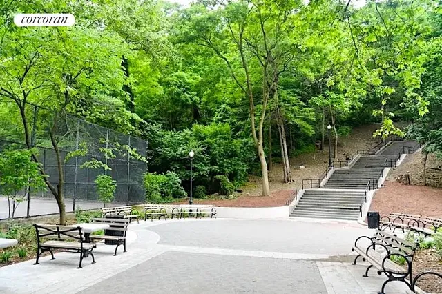 a view of backyard with a table and chairs and potted plants