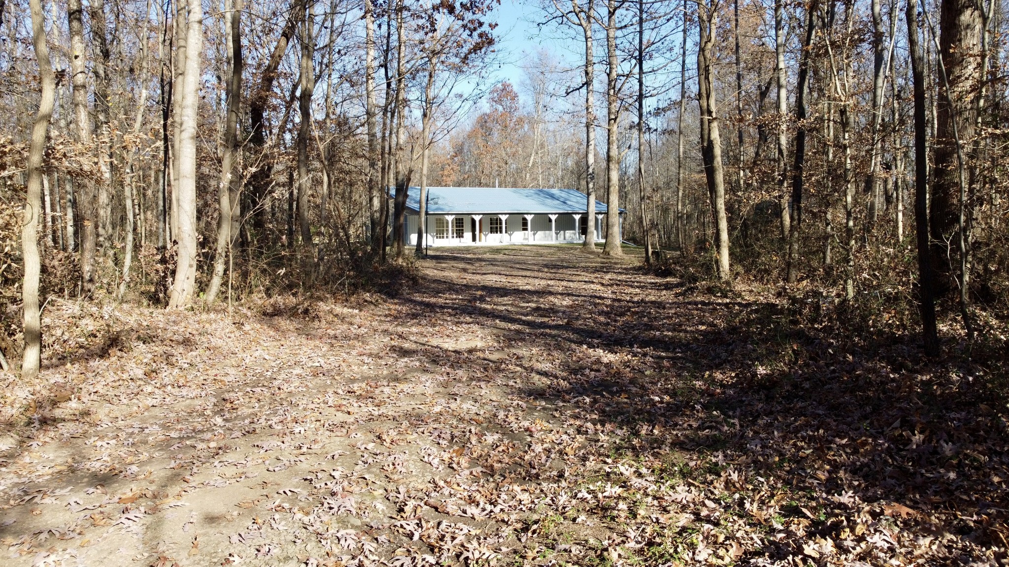 581 Nim Road Red Boiling Springs, TN 37150 - Photo 4 of 26 a view of a house with large trees