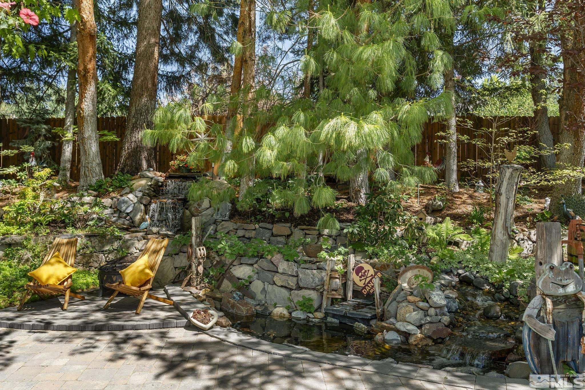 930 Spanish Springs Road Sparks, NV 89434 - Photo 11 of 40 a view of a yard with plants and large trees