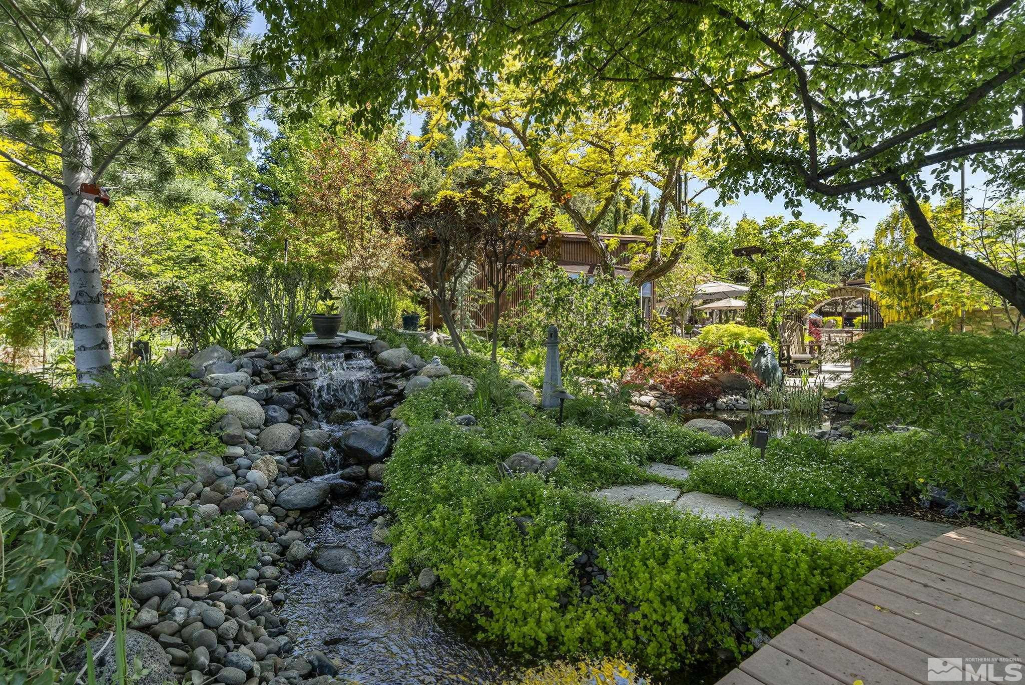 930 Spanish Springs Road Sparks, NV 89434 - Photo 14 of 40 a view of a large yard with lots of plants and trees