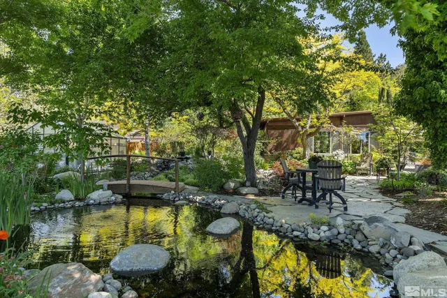 a view of backyard with patio and outdoor seating