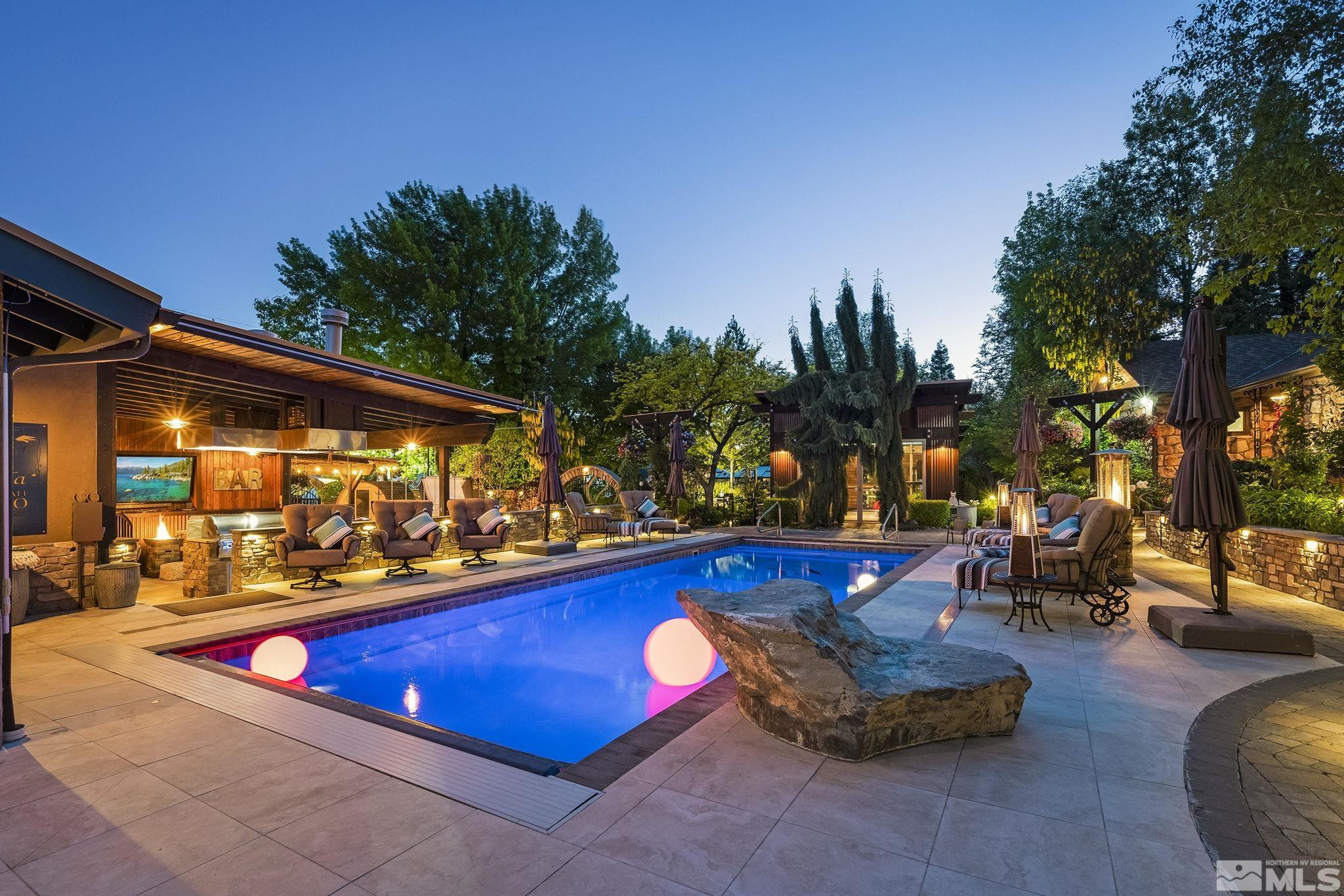 930 Spanish Springs Road Sparks, NV 89434 - Photo 2 of 40 a swimming pool with outdoor seating and yard