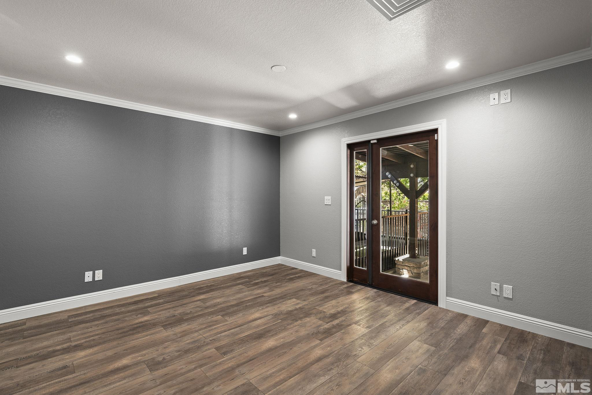 930 Spanish Springs Road Sparks, NV 89434 - Photo 22 of 40 an empty room with entrance and windows