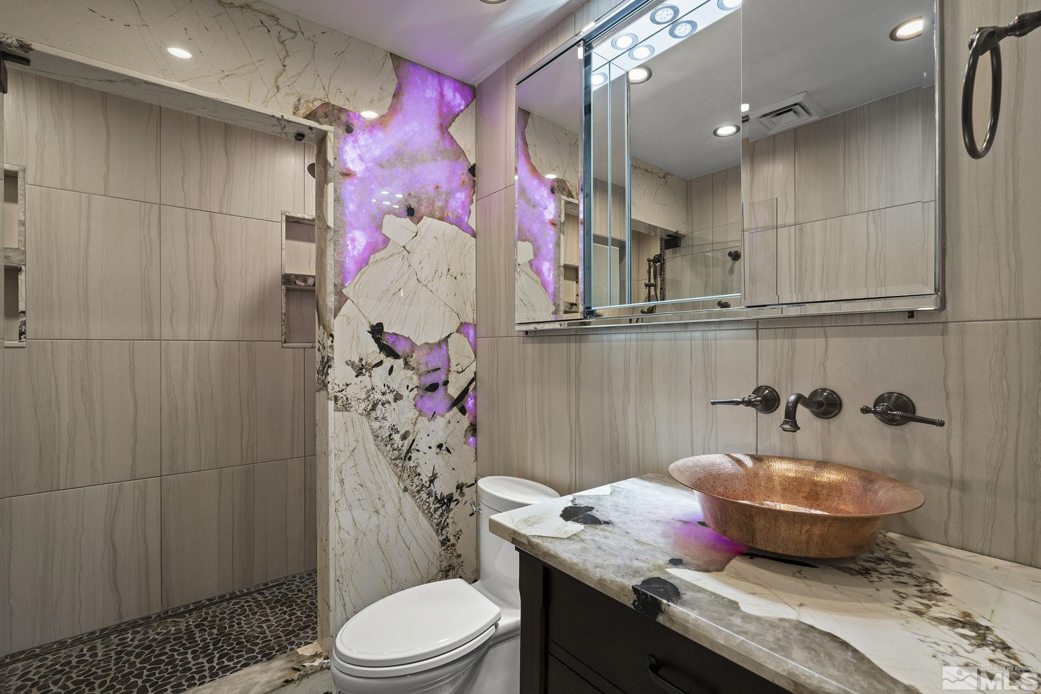 930 Spanish Springs Road Sparks, NV 89434 - Photo 23 of 40 a bathroom with a granite countertop bathtub sink vanity mirror and toilet