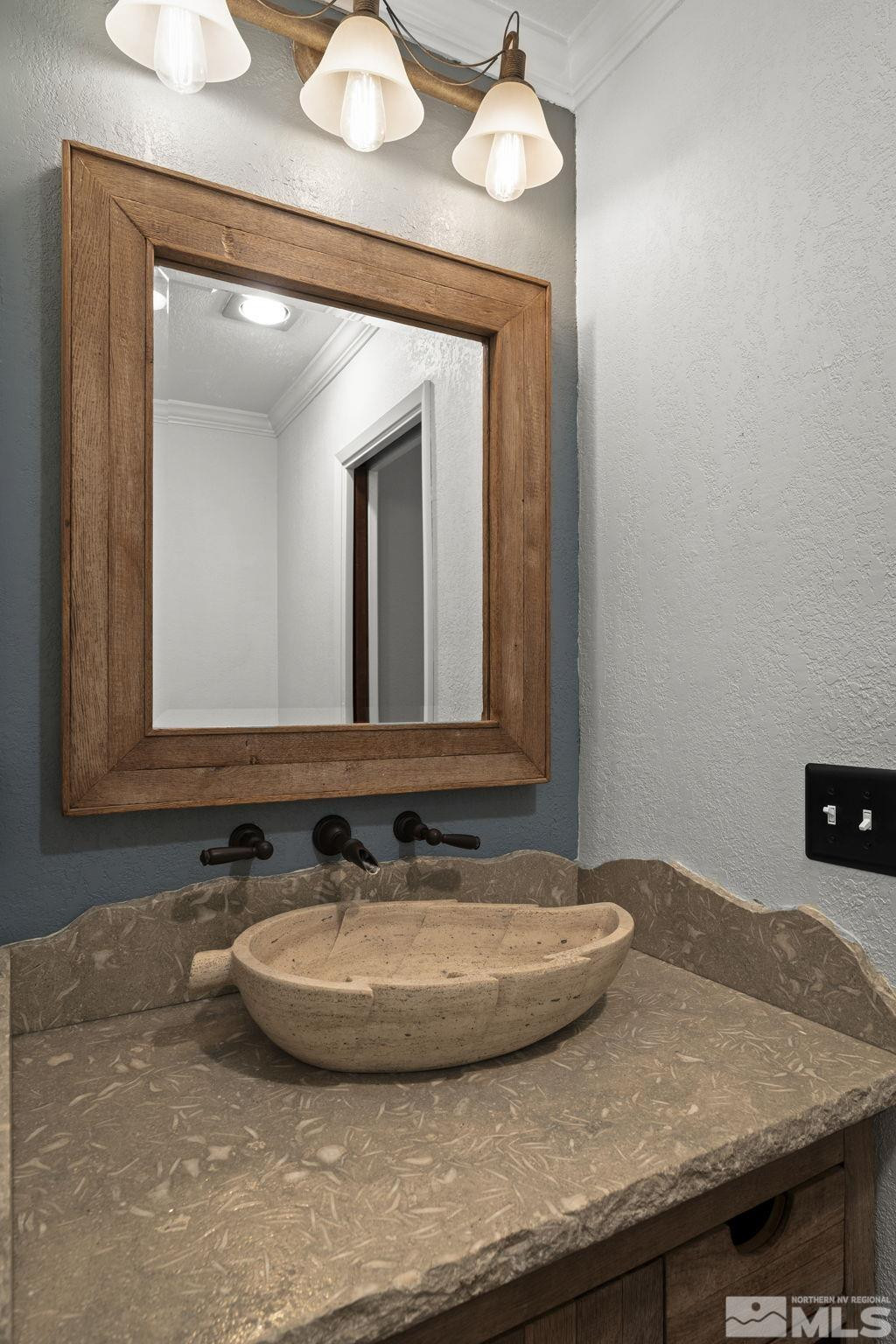 930 Spanish Springs Road Sparks, NV 89434 - Photo 24 of 40 a bathroom with a granite countertop sink and a mirror