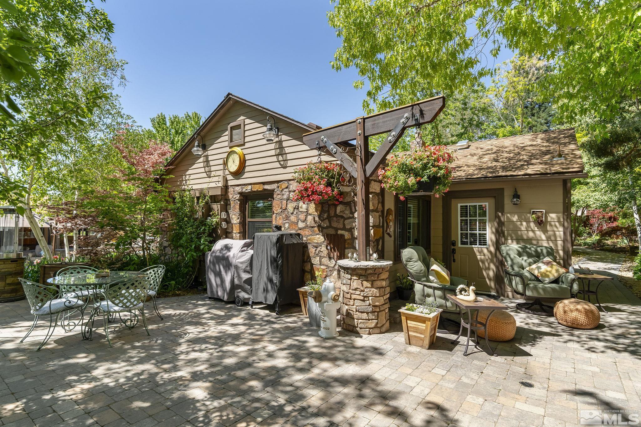 930 Spanish Springs Road Sparks, NV 89434 - Photo 25 of 40 a view of a house with backyard and sitting area