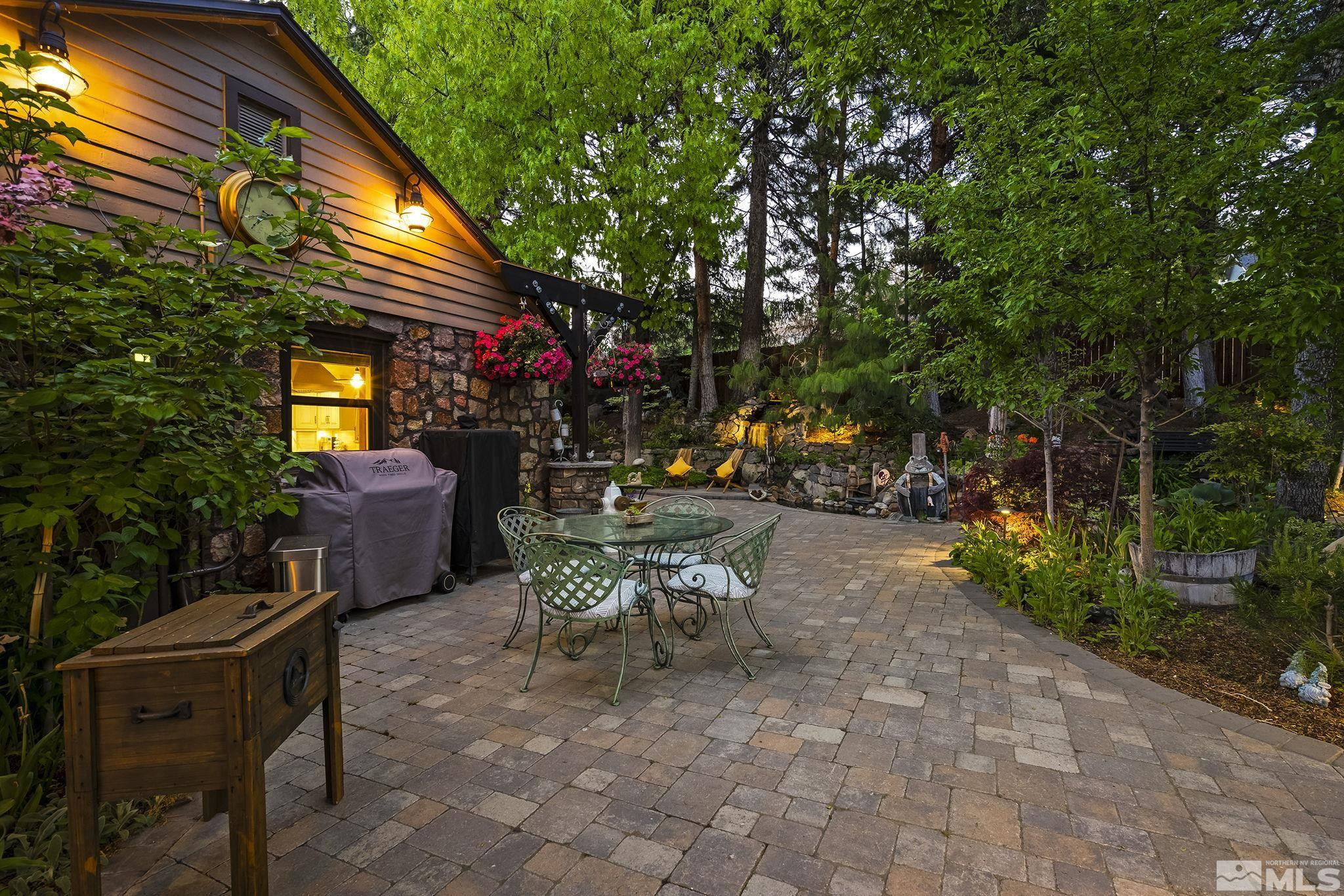 930 Spanish Springs Road Sparks, NV 89434 - Photo 35 of 40 a view of a patio with table and chairs and potted plants