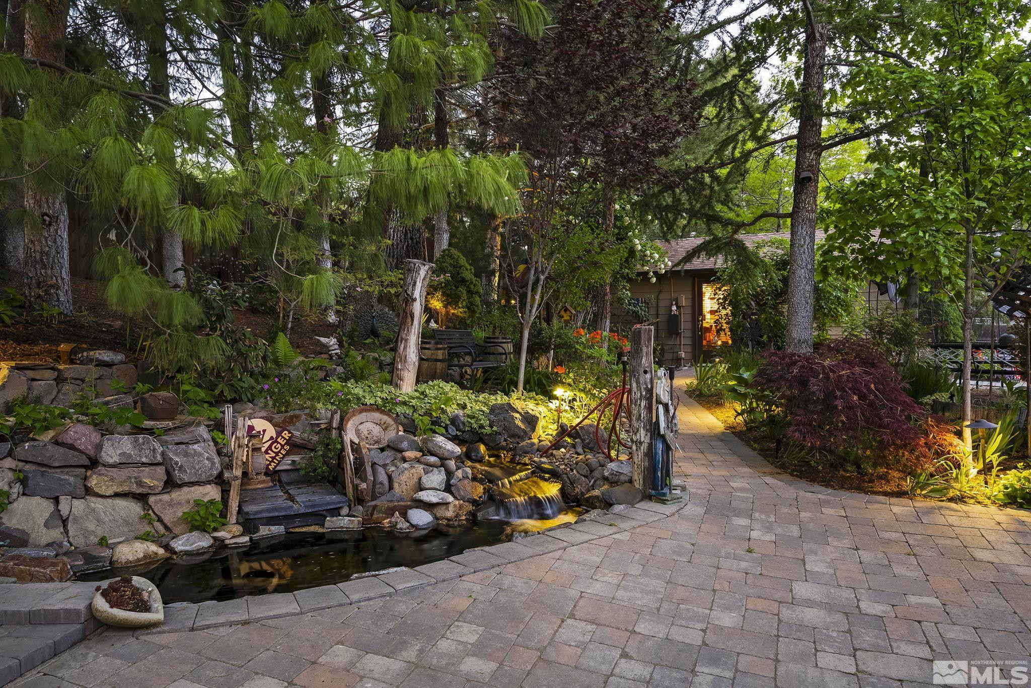 930 Spanish Springs Road Sparks, NV 89434 - Photo 36 of 40 a view of a garage with lawn chairs and a fire pit
