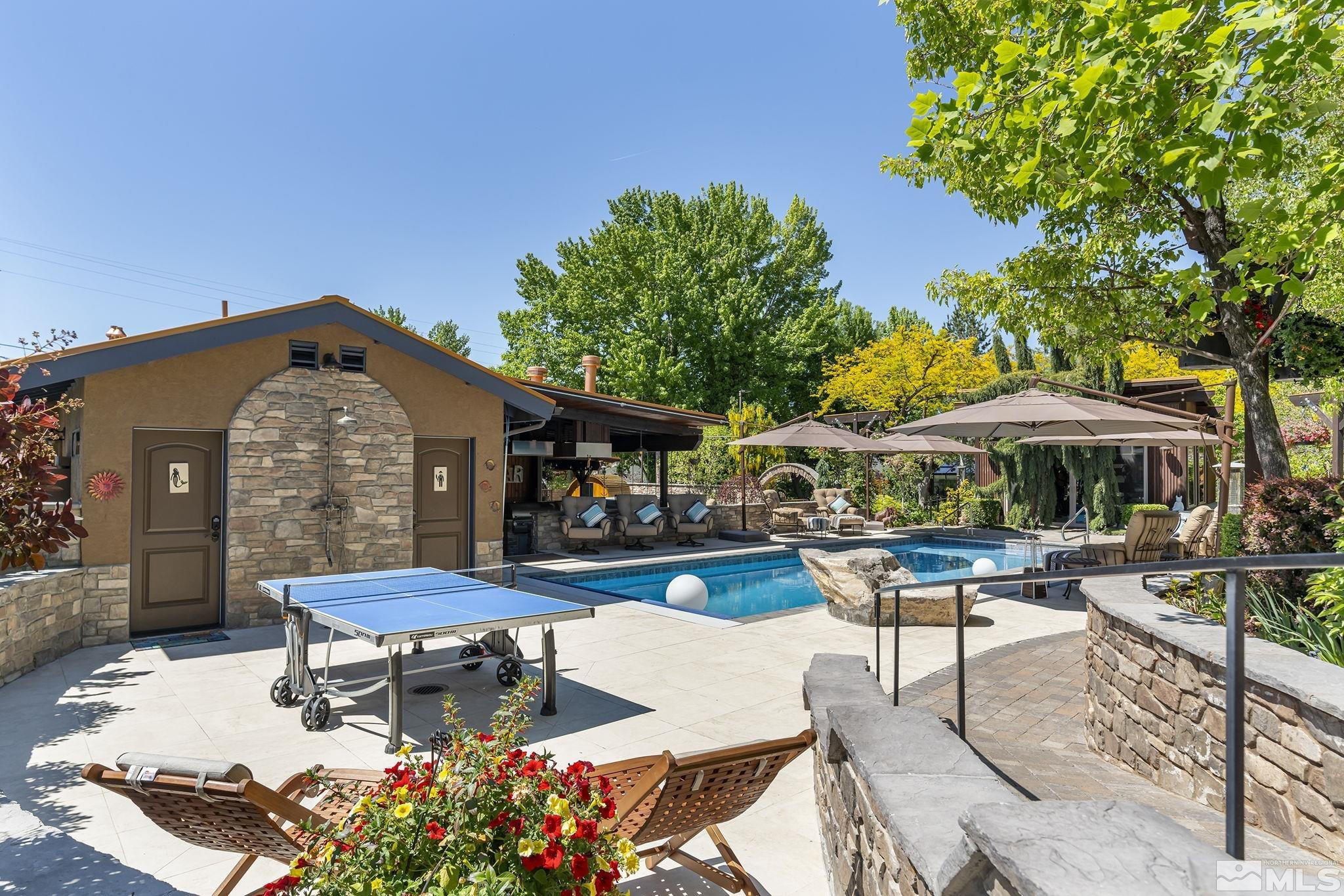 930 Spanish Springs Road Sparks, NV 89434 - Photo 7 of 40 a view of a house with backyard sitting area and swimming pool