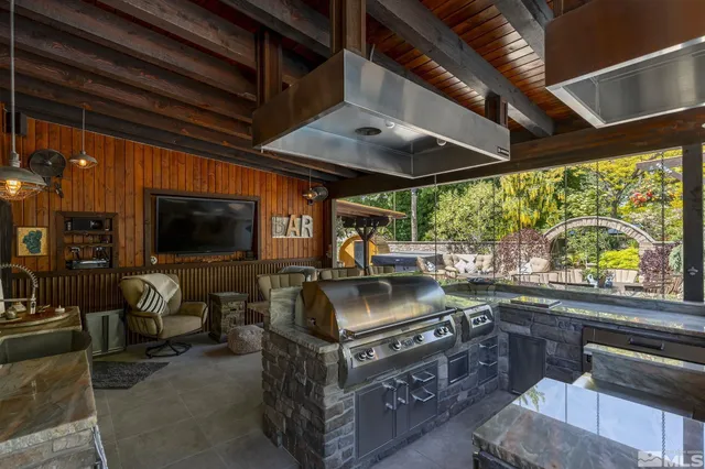 a view of a chairs and table in a patio