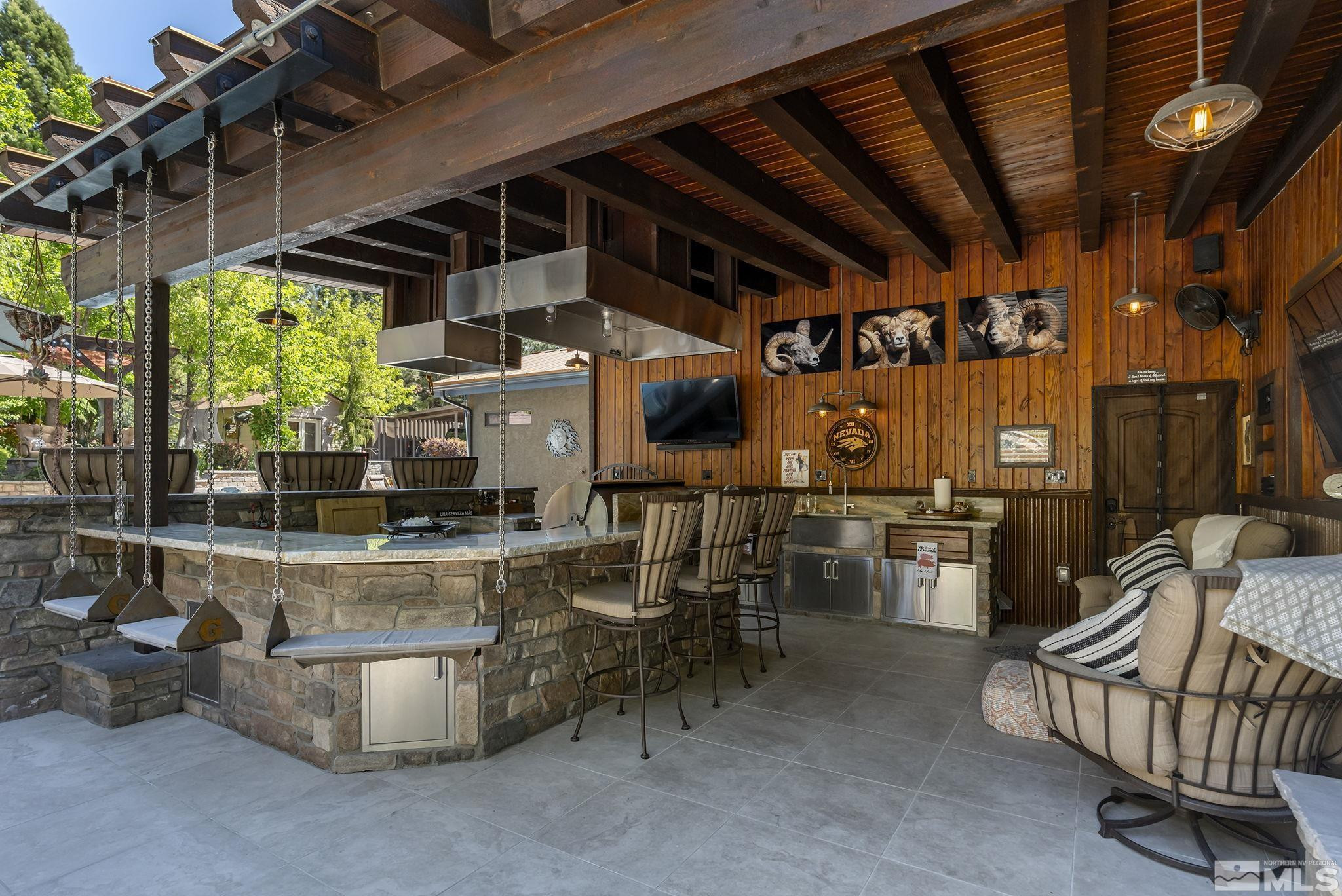 930 Spanish Springs Road Sparks, NV 89434 - Photo 10 of 40 a view of a chairs and table in a patio